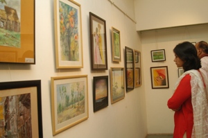 Visitors looking at the artworks at Artfest 09, Indiaart Gallery